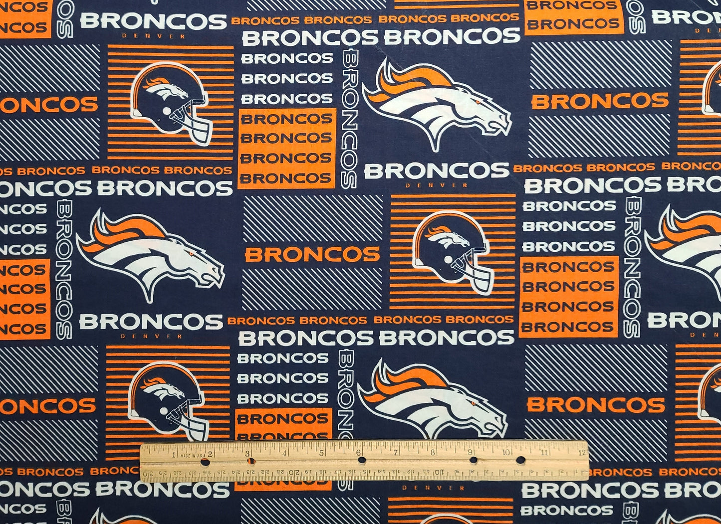 56" WIDE 2013 NFL #6422 - Dark Blue Fabric / Orange and White Denver Broncos Football Print Fabric