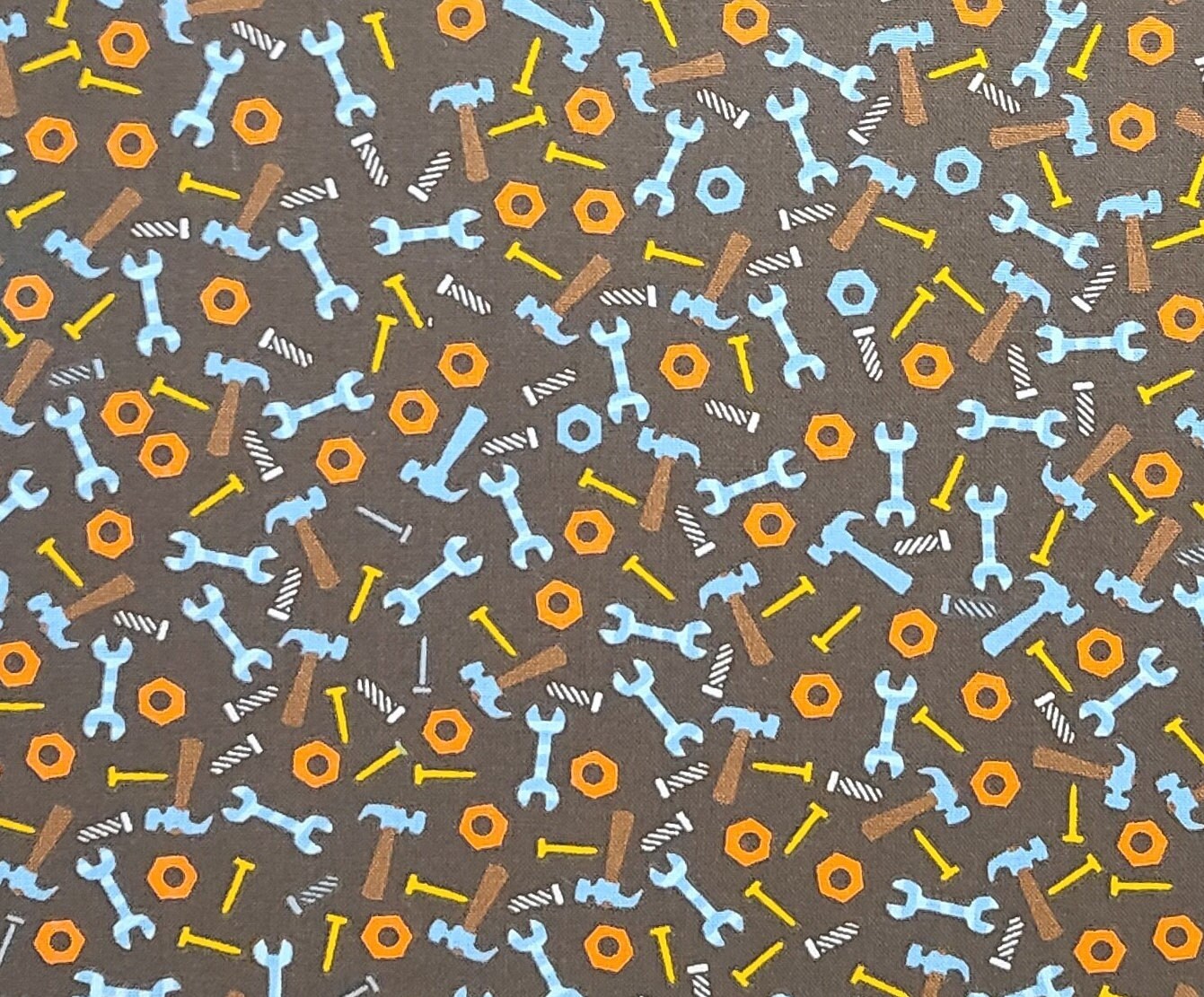 JoAnn Fabrics - Dark Brown Fabric / Orange, Blue, Gold Hammer, Wrench, Nail Print Fabric