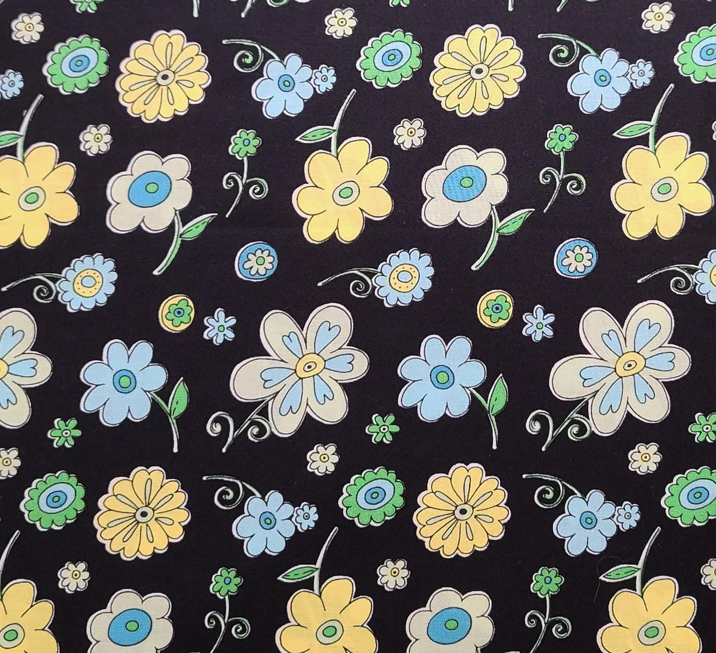 Patt BTR-3641 Black Textiles Inc - Black Fabric / Blue and Yellow Cartoon-Style Flower Print