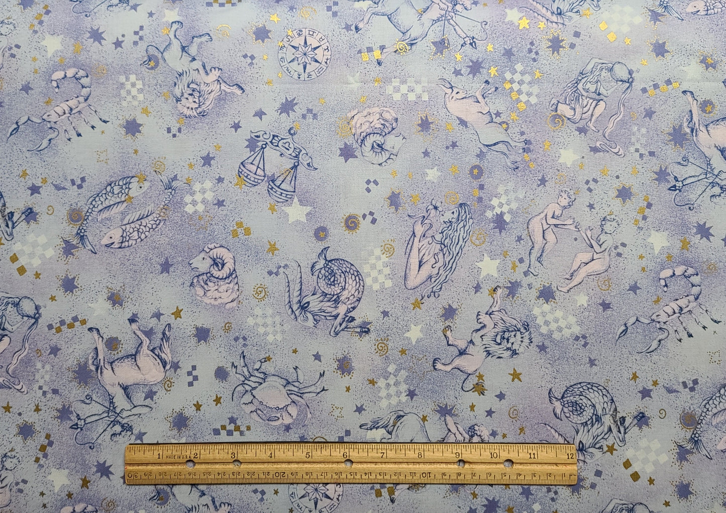 Quilters Only #5873 Springs Industries - Pale Blue and Lavender Tonal Fabric / Tossed Zodiac Signs Print