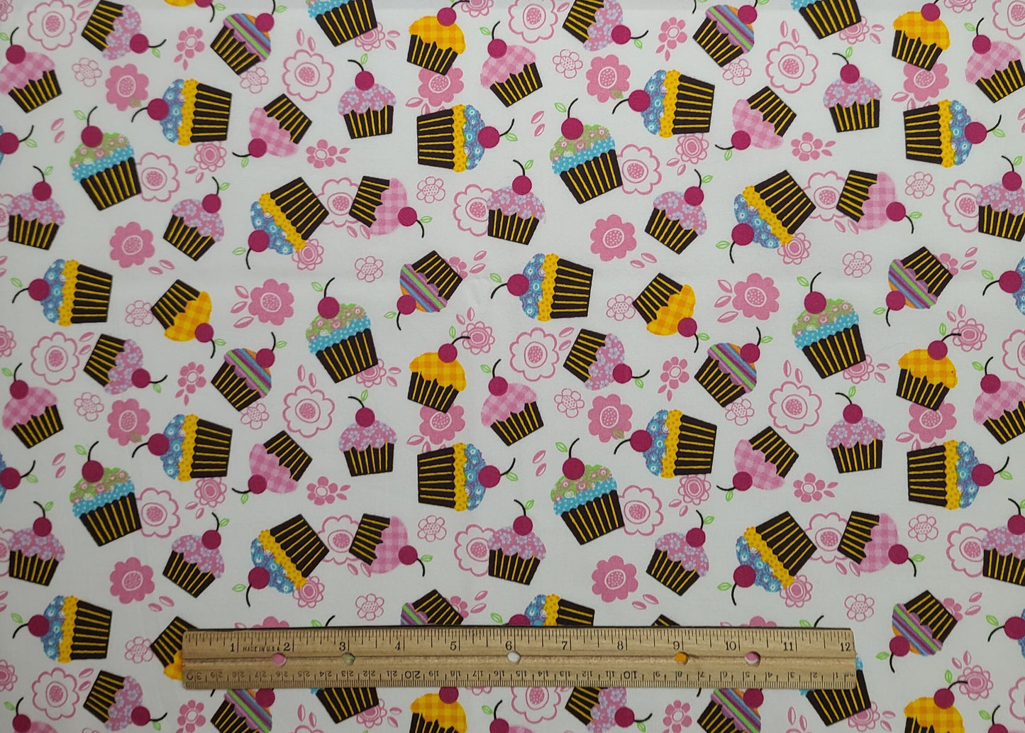 JoAnn Fabrics - White Fabric / Tossed Flower and Cupcake Print / Brown, Yellow, Pink