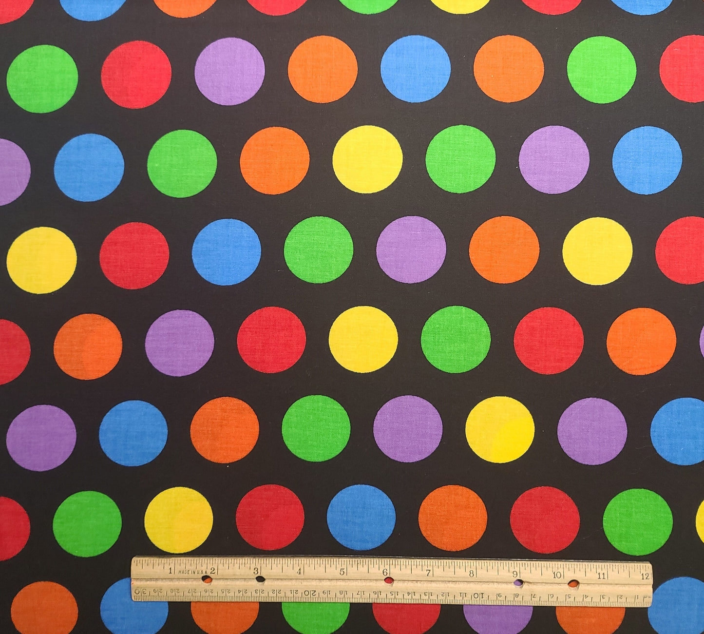 Signature Classics by Oakhurst Textiles - Black Fabric / 1-3/4" Brightly Colored Polka Dot Print / Red, Yellow, Blue, Green, Purple, Orange