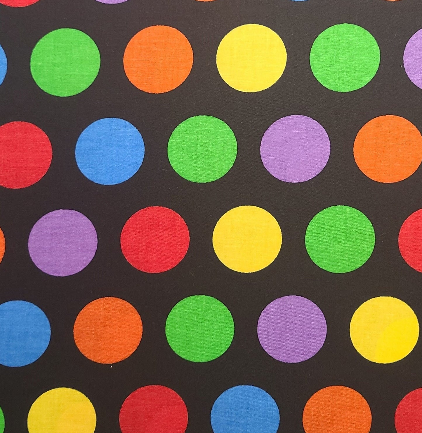 Signature Classics by Oakhurst Textiles - Black Fabric / 1-3/4" Brightly Colored Polka Dot Print / Red, Yellow, Blue, Green, Purple, Orange