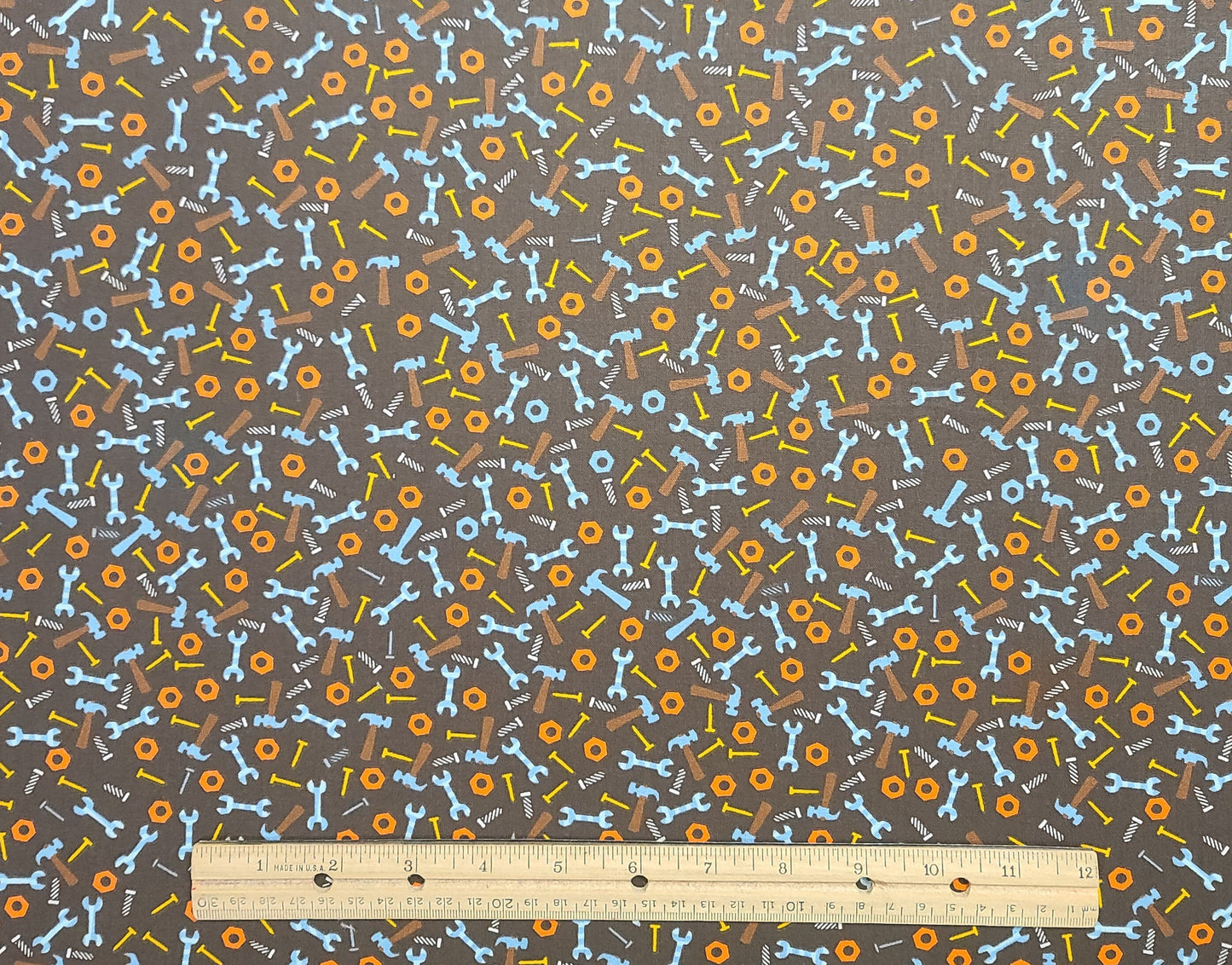 JoAnn Fabrics - Dark Brown Fabric / Orange, Blue, Gold Hammer, Wrench, Nail Print Fabric