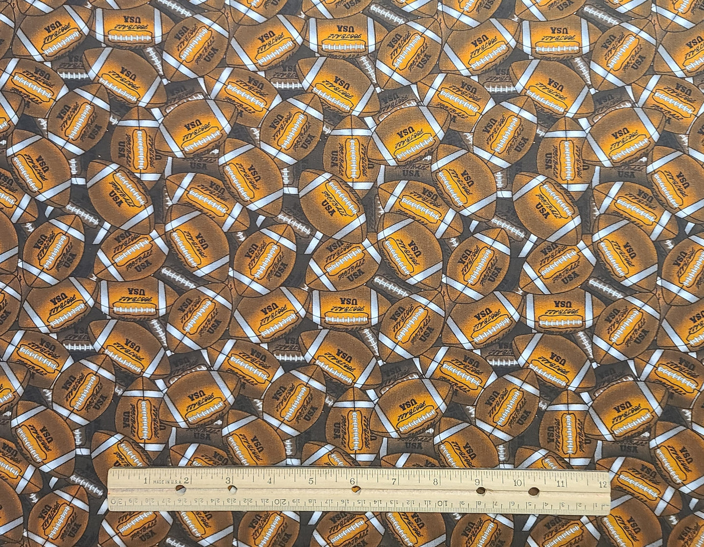 David Textiles Inc - Dark Brown Fabric / Allover Football Print