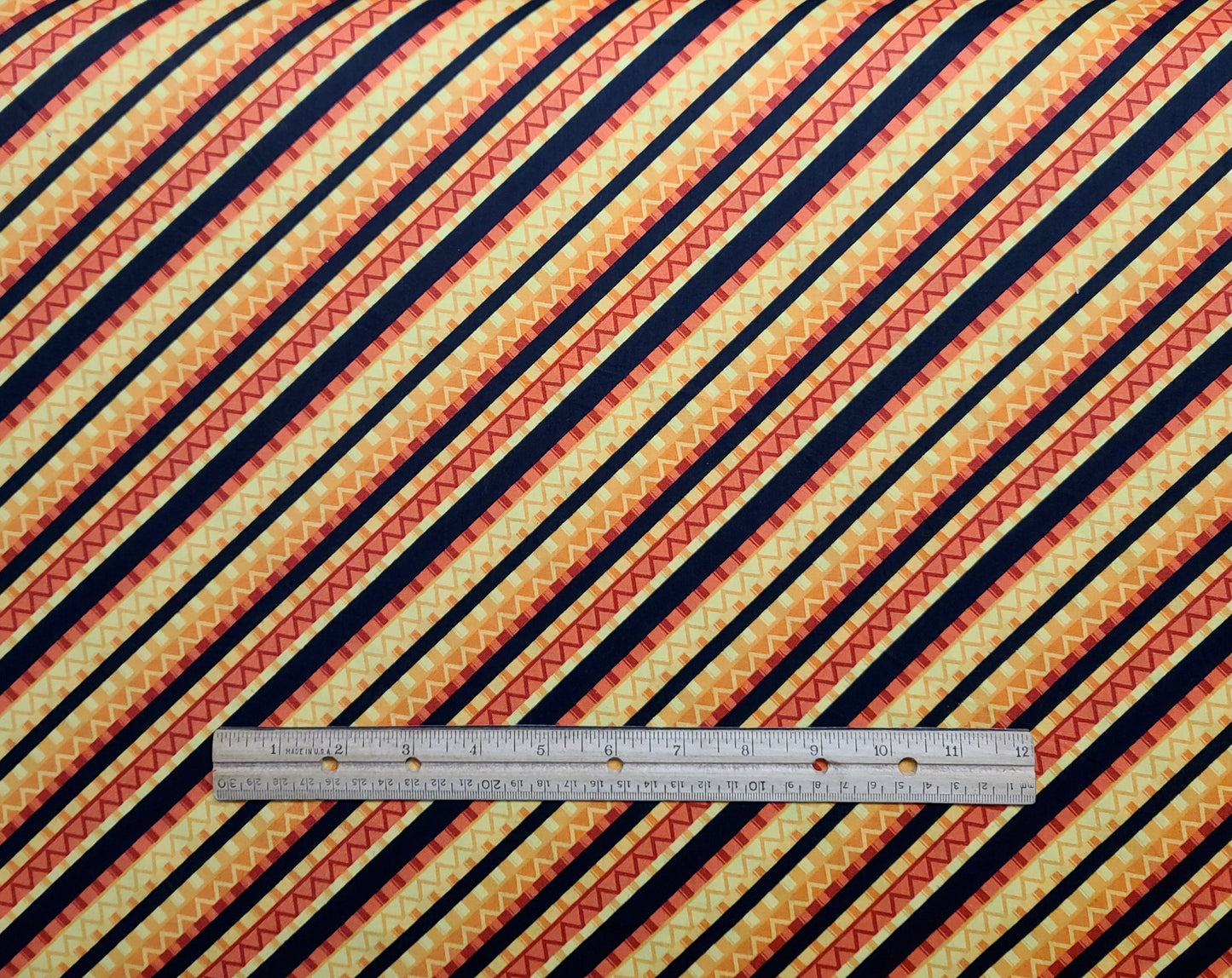 Caliente Peppers TRD Portfolio WP - Black, Yellow, Gold, Red, Coral Diagonal Stripe Fabric