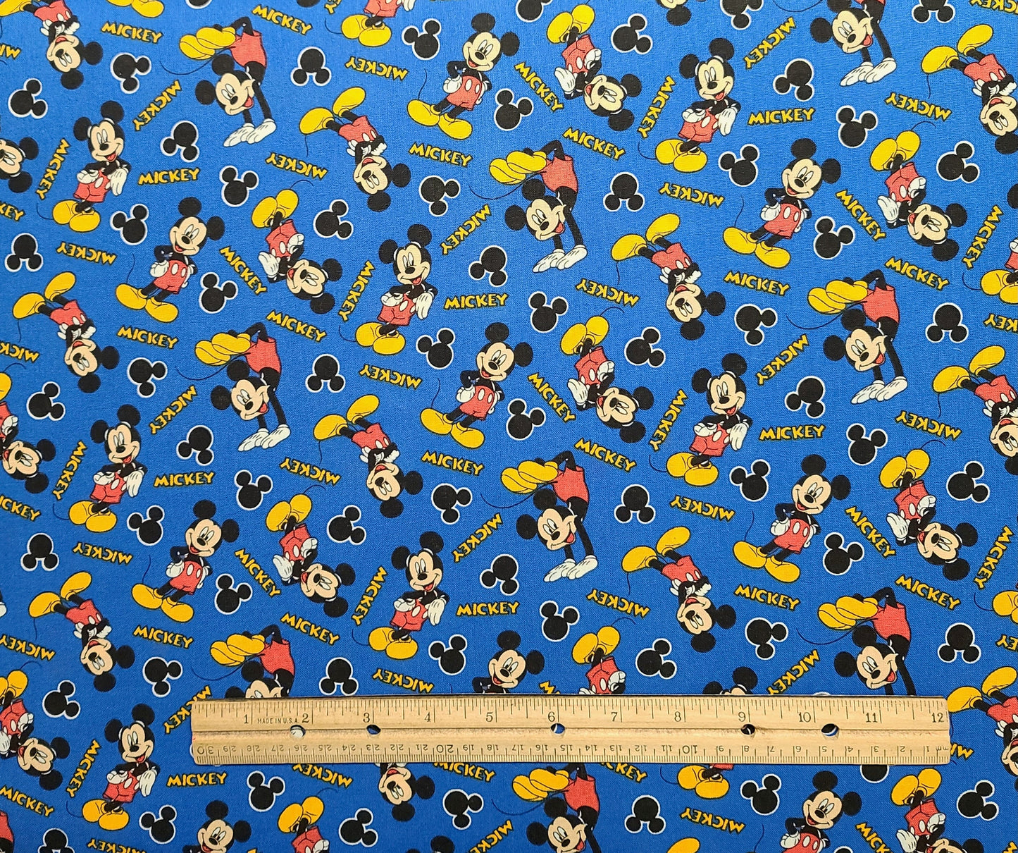 CP58067 Mickey 28 Disney for Springs Creative Products Group 2015 - Blue Fabric / Red, Gold, Black, White Tossed Mickey Print