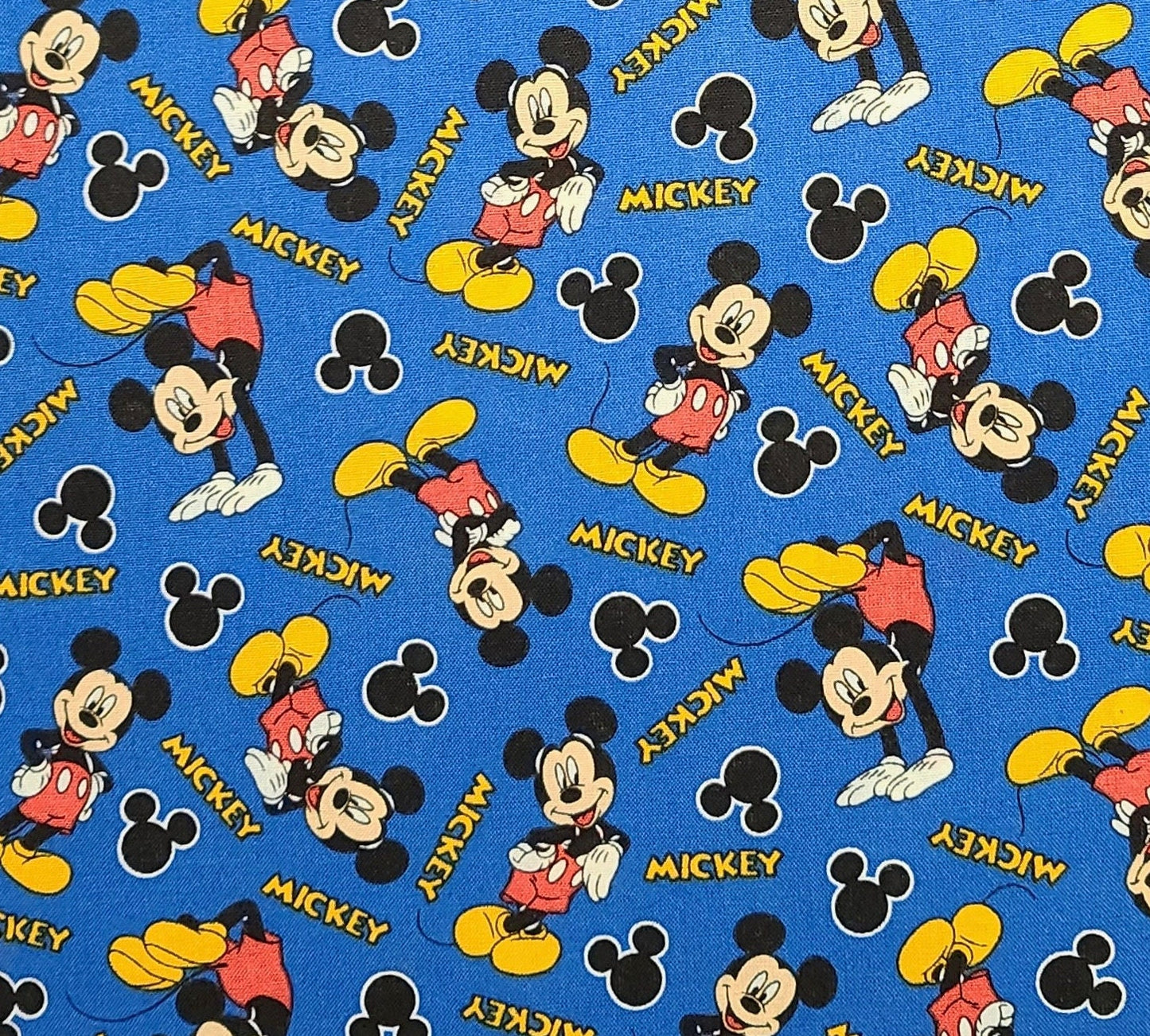 CP58067 Mickey 28 Disney for Springs Creative Products Group 2015 - Blue Fabric / Red, Gold, Black, White Tossed Mickey Print