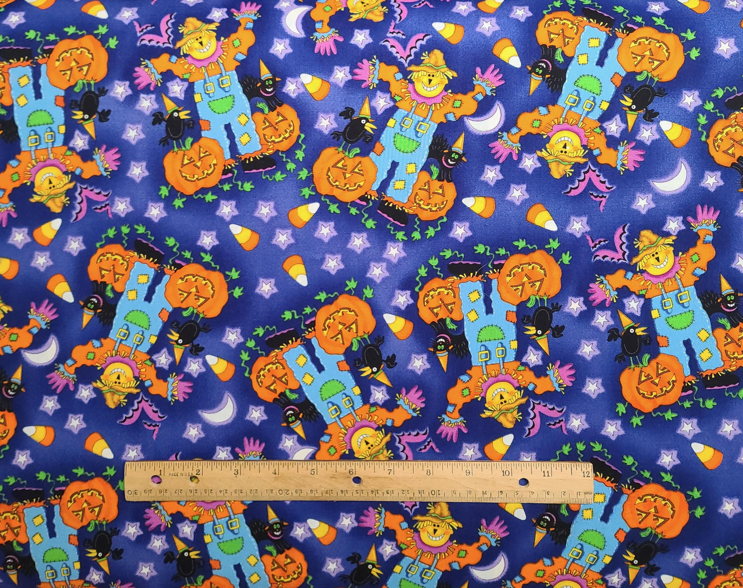 Timeless Treasures for Hi-Fashion Fabric Inc 1999 - Blue, Purple, Orange, Bright Blue Scarecrow Print Fabric