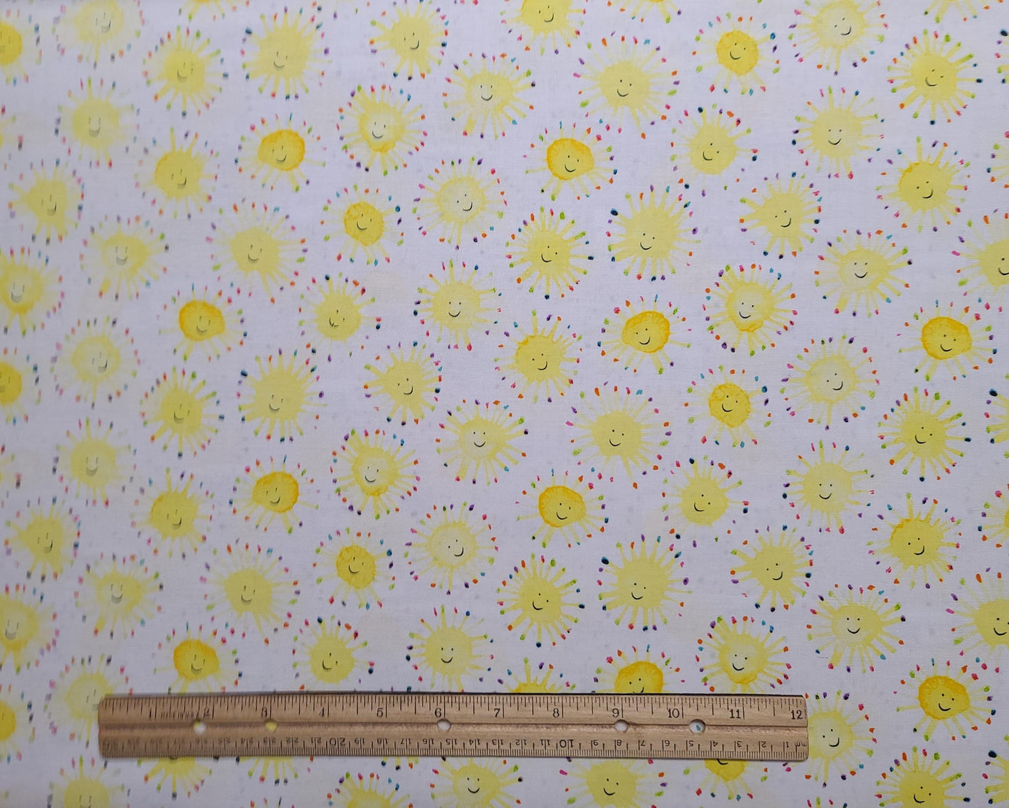 Wyndham Fabrics Presents Rain or Shine by Maria Carluccio Pattern #51650 - White Fabric / Bright Yellow Happy Face Sun / Bright Pastel Ring