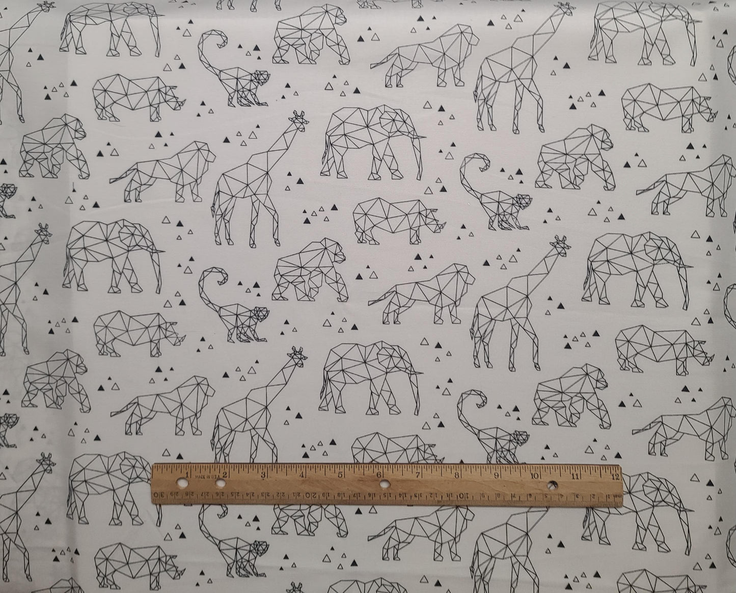 Zoometrix 22412 Deborah Edwards Northcott - White Fabric / Black Geometric Ape, Monkey, Elephant, Lion, Giraffe Print