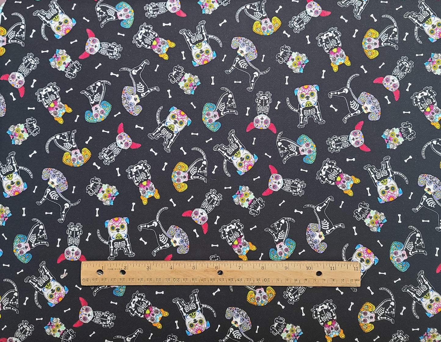 Hi-Fashion Fabrics Patt#7273 - Black Fabric / White Dia de Los Muertos Dog Print / Yellow, Teal, Red