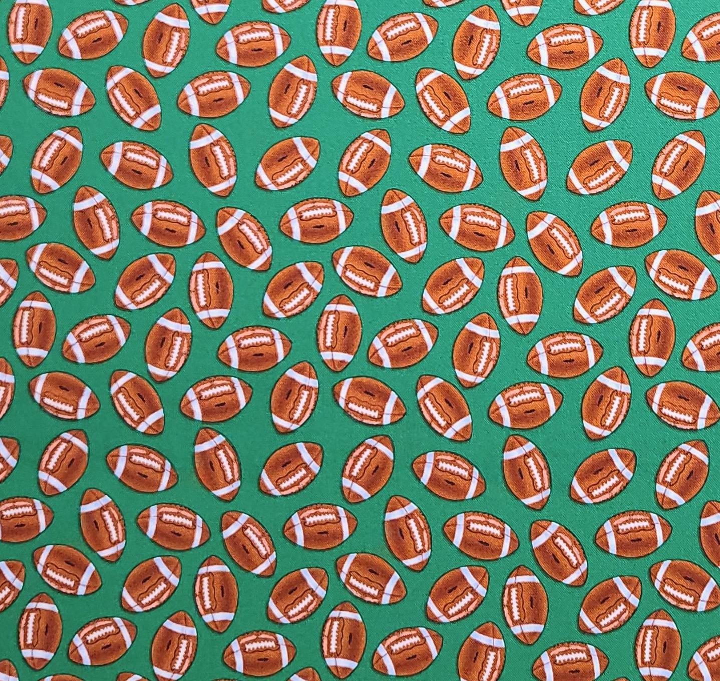 Timeless Treasures Fabrics Inc Patt #GAIL-C1731 - Green Fabric / Tossed Football Print