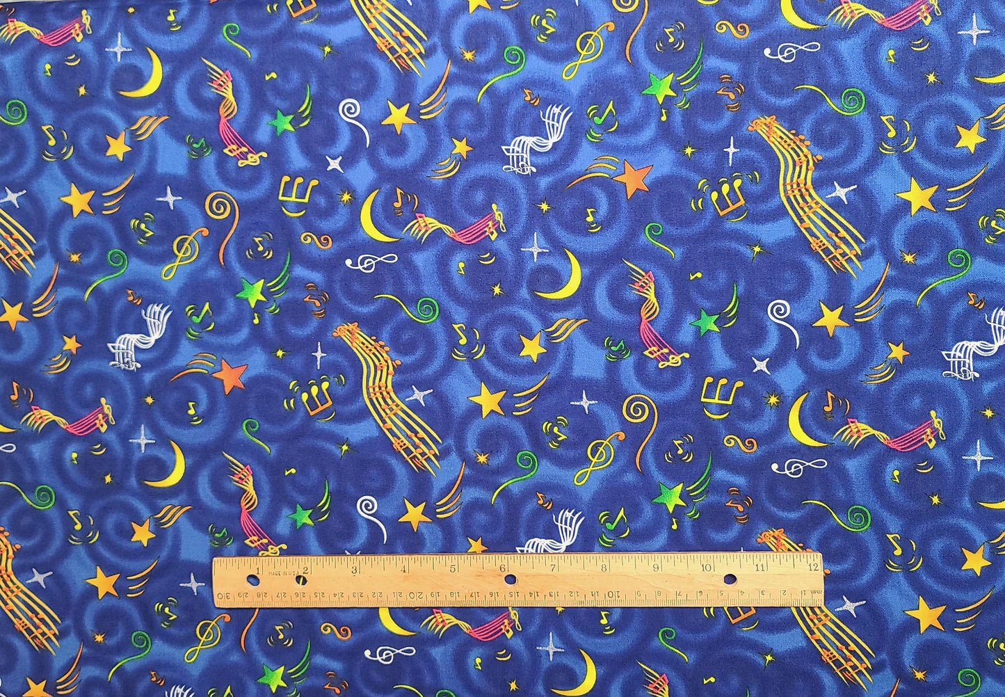 Blue Tonal Fabric / Bright Primary Colored Tossed Musical Note, Sheet Music, Shooting Star Print