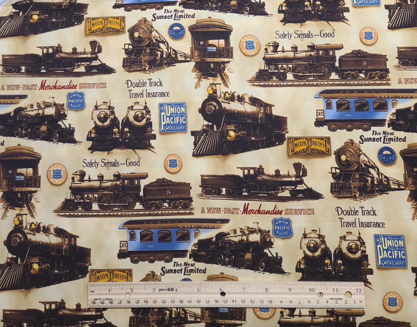 EOB - Union Pacific D#7685 Looking Good Licensing Robert Kaufman - Antique Gold Tonal Fabric / Union Pacific Badges and Locomotive Print