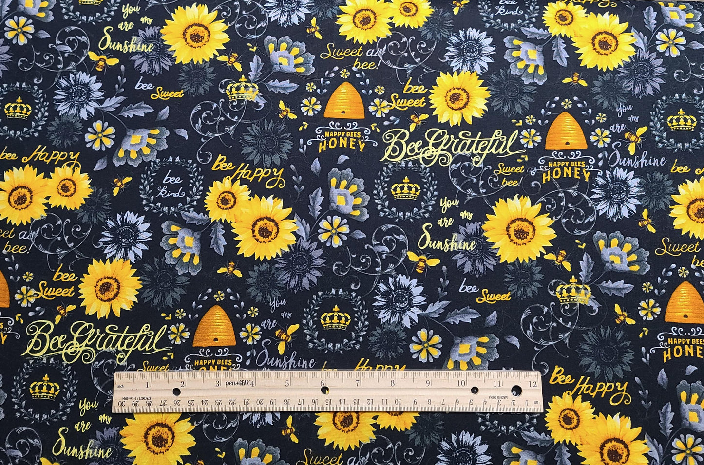 Hi-Fashion Fabrics 1436 - Black Fabric / Gray, Gold, Yellow Flower and Bee Print and Script