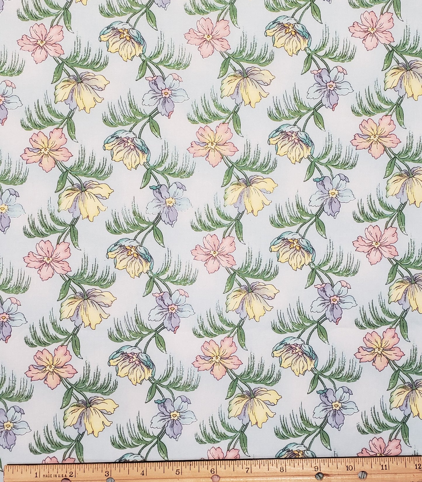 Garden Romance by Cheri L. Strole Licensed to SSI - Pastel Blue Fabric / Flowers in Pastel Pink, Yellow and Periwinkle