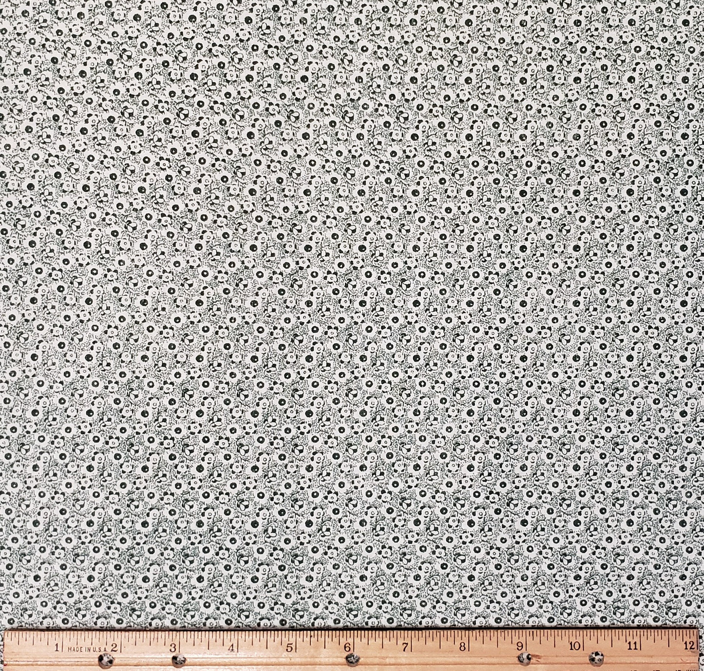 Dark Green Fabric / White "Ditsy" Floral Pattern