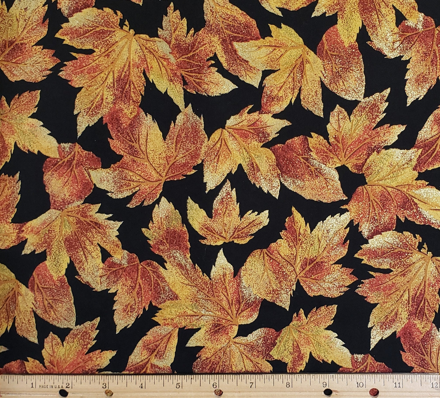 Black Fabric with Dark Red, Burnt Orange and Gold Leaves with Metallic Accents