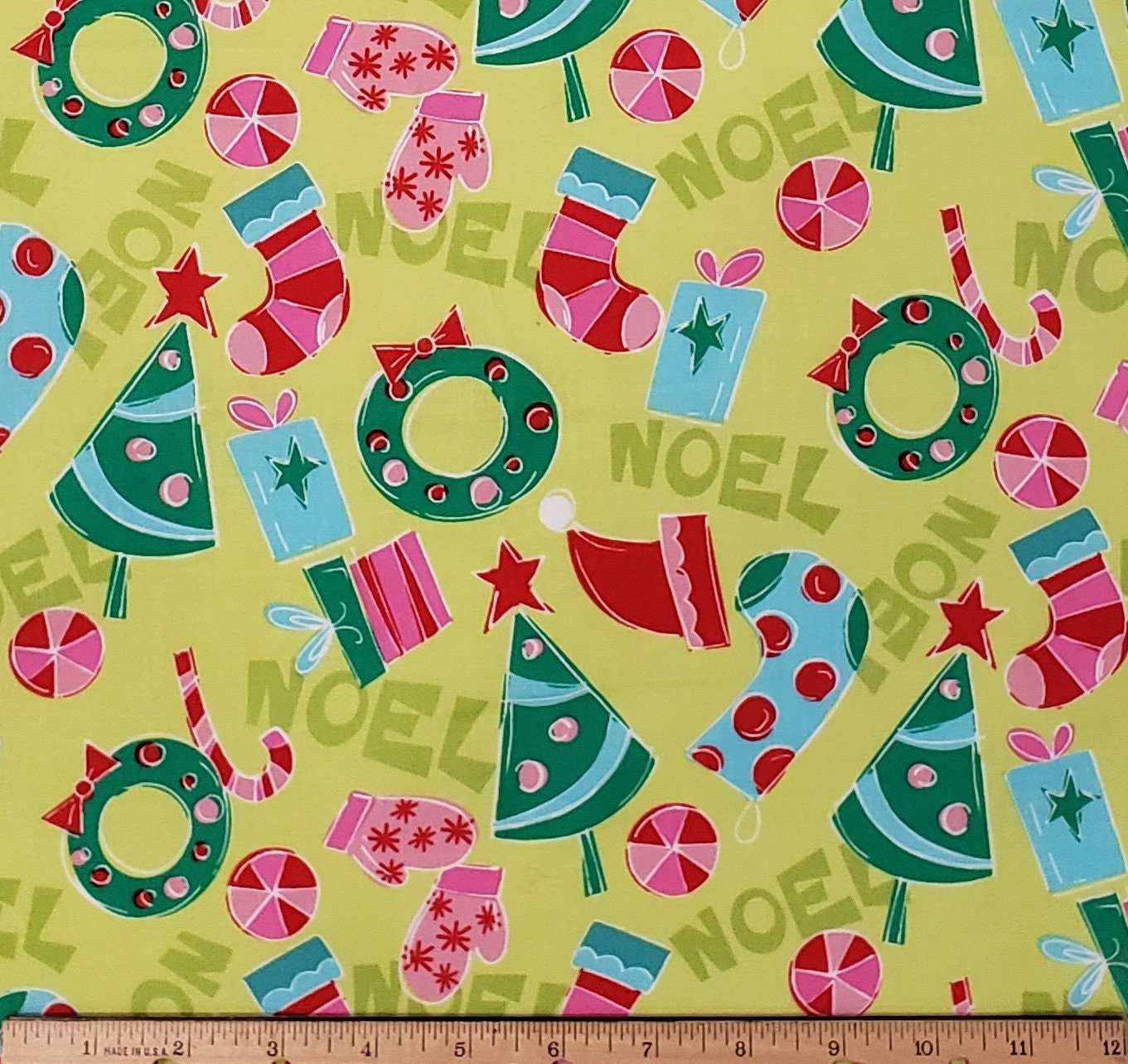 CP 22469 NOEL Springs Creative Products Group - Bright Green NOEL Print Fabric with Pink, Light Blue and Green Holiday Print