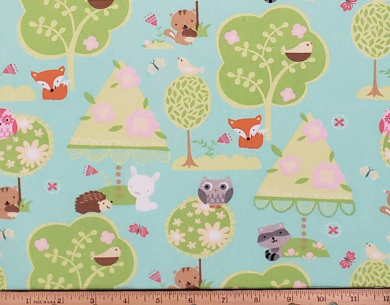 JoAnn Fabric - Juvenile Light Aqua Fabric with Trees, Hedgehog, Raccoon, Fox, Rabbit and Owl Print