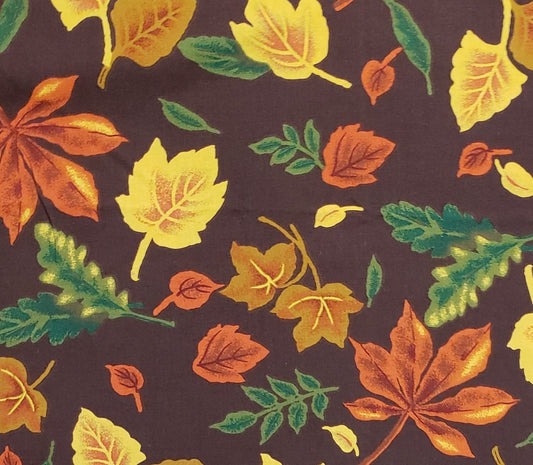 Marcus Brothers Textiles, Inc. - Dark Chocolate Brown Fabric with Orange, Yellow, Tan and Green Leaf Print