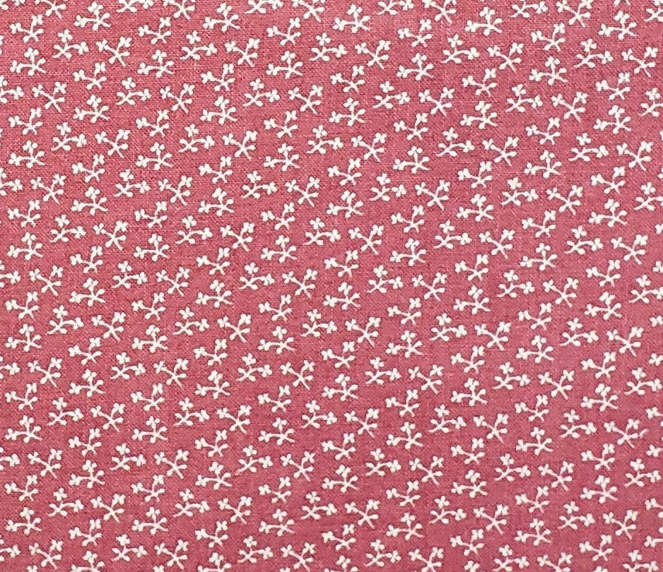 Marcus Bros. Textiles, Inc.  - Colonial Dark Pink Fabric with Tiny White Flower Print