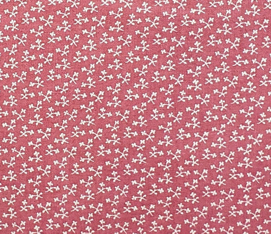 Marcus Bros. Textiles, Inc.  - Colonial Dark Pink Fabric with Tiny White Flower Print