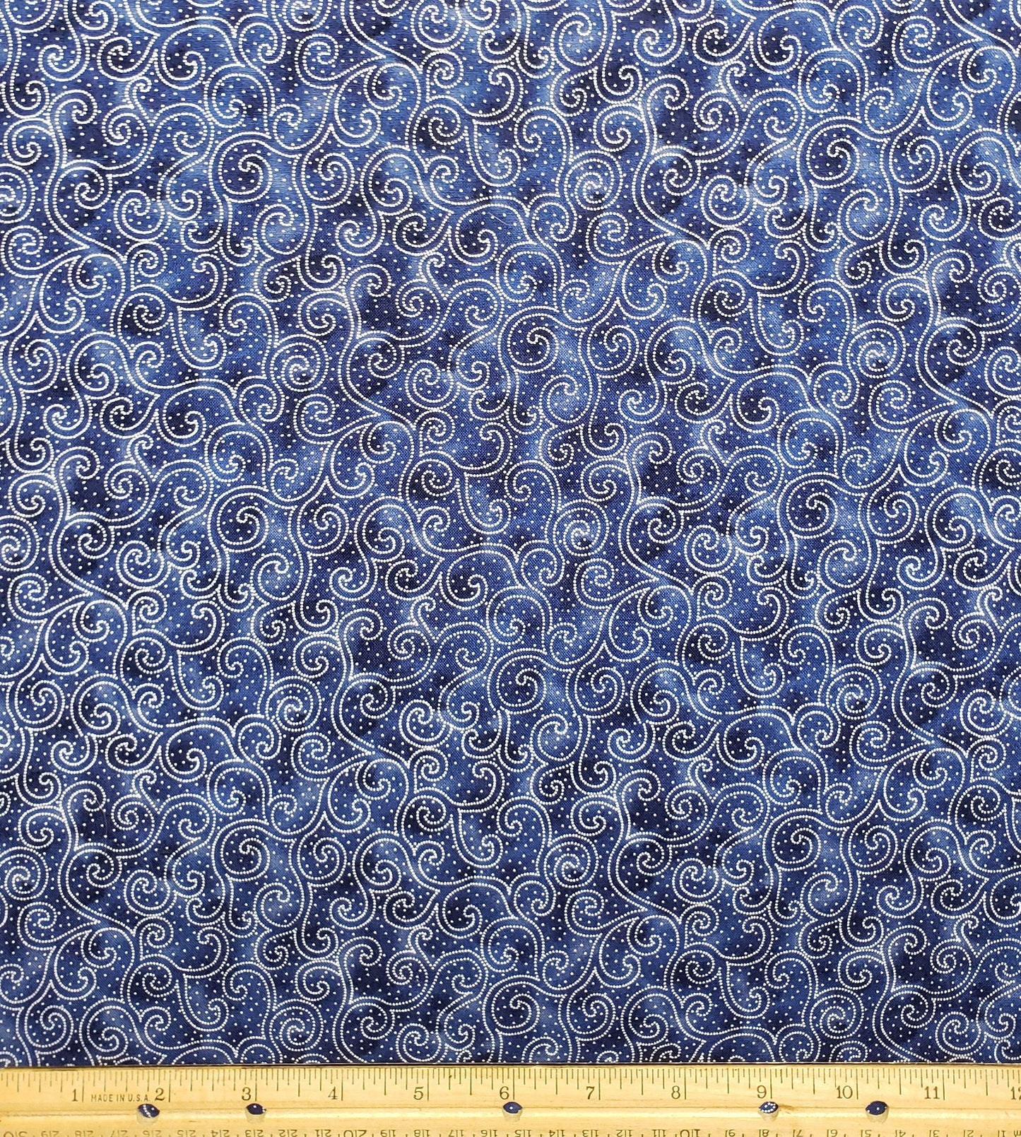EOB - JoAnn Screen Print D# 4742 "Quilters Spectrum" - Mottled Dark Blue Fabric with White Dot Scroll Pattern