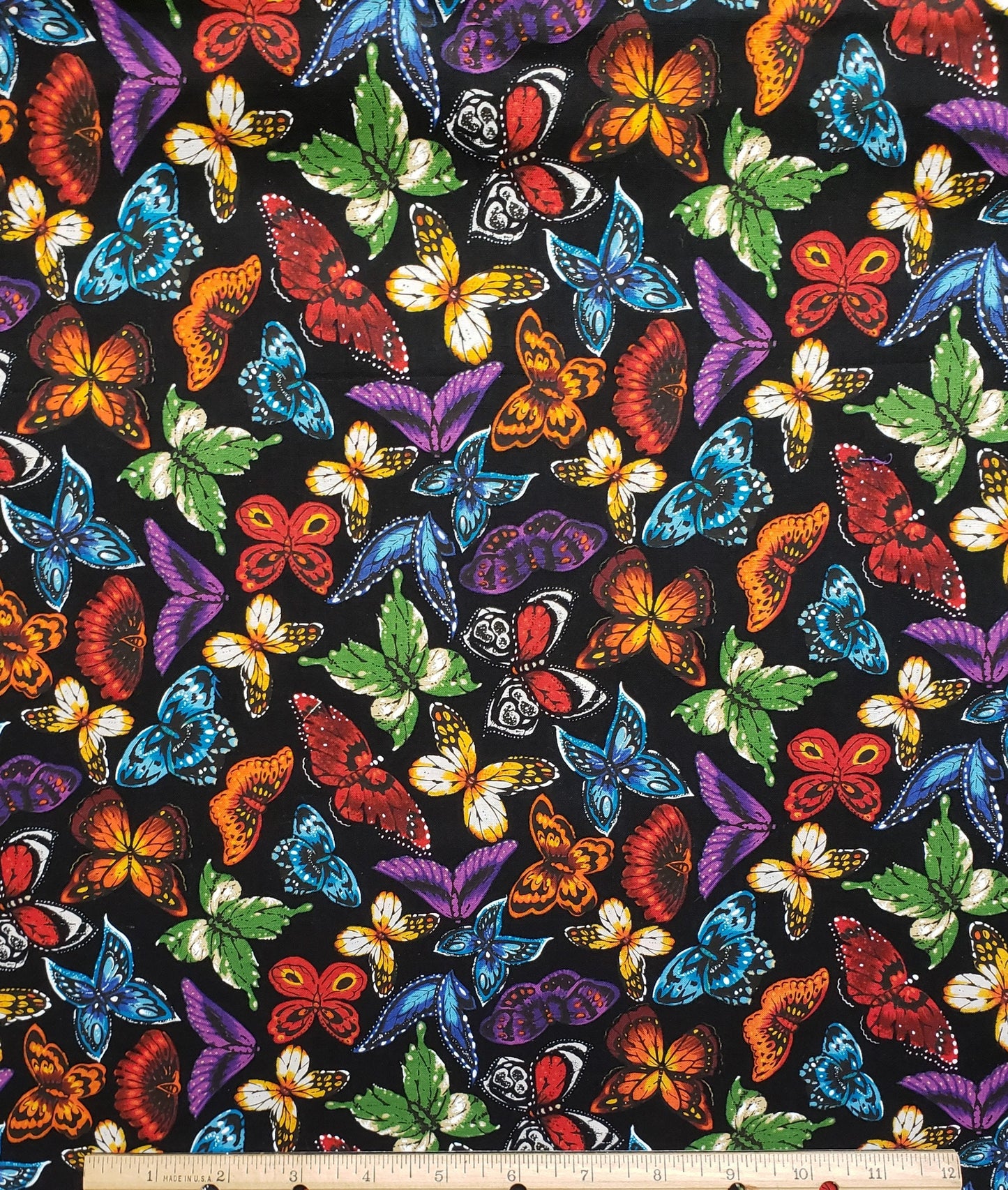 Black Fabric with Brightly Colored Butterfly Print