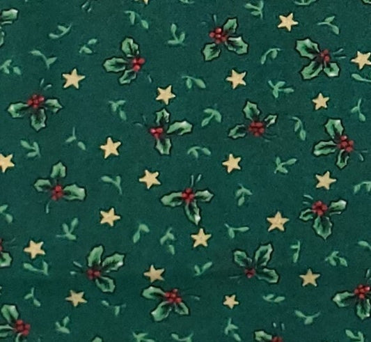 Season's Greetings from Fabri Quilt Pattern 812 - Dark Green Fabric / Holly and Gold Star Print