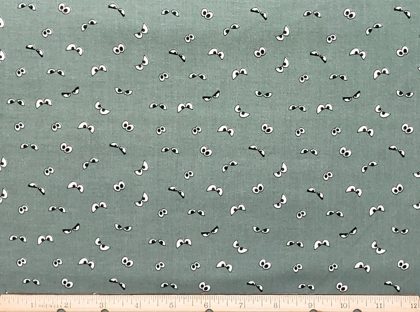 Riley Blake Design Pattern GC10576 Spooky Hollow by Melissa Mortenson 2021 - Dark Sage Fabric / Spooky Glow-in-the-Dark Eye Print