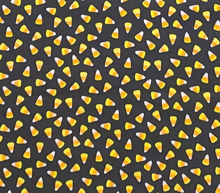 Black Fabric  / Orange, Yellow and White Tossed Candy Corn Print