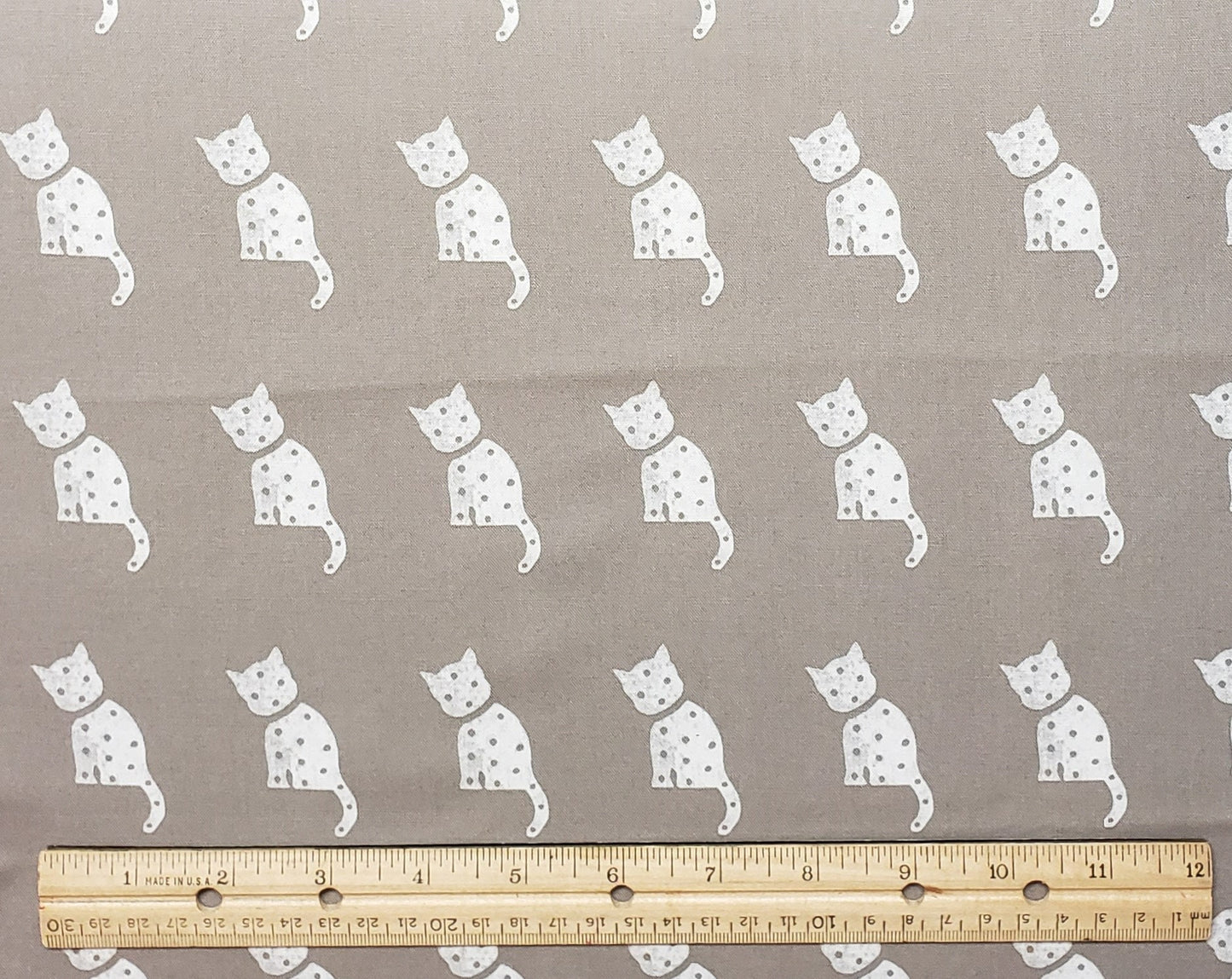 Riley Blake Design Pattern c10599. Old Made by J. Wecker Frisch 2021 - Cat Stamp - Gray Fabric / White Cat - Polka Dotted Cat Silhouette