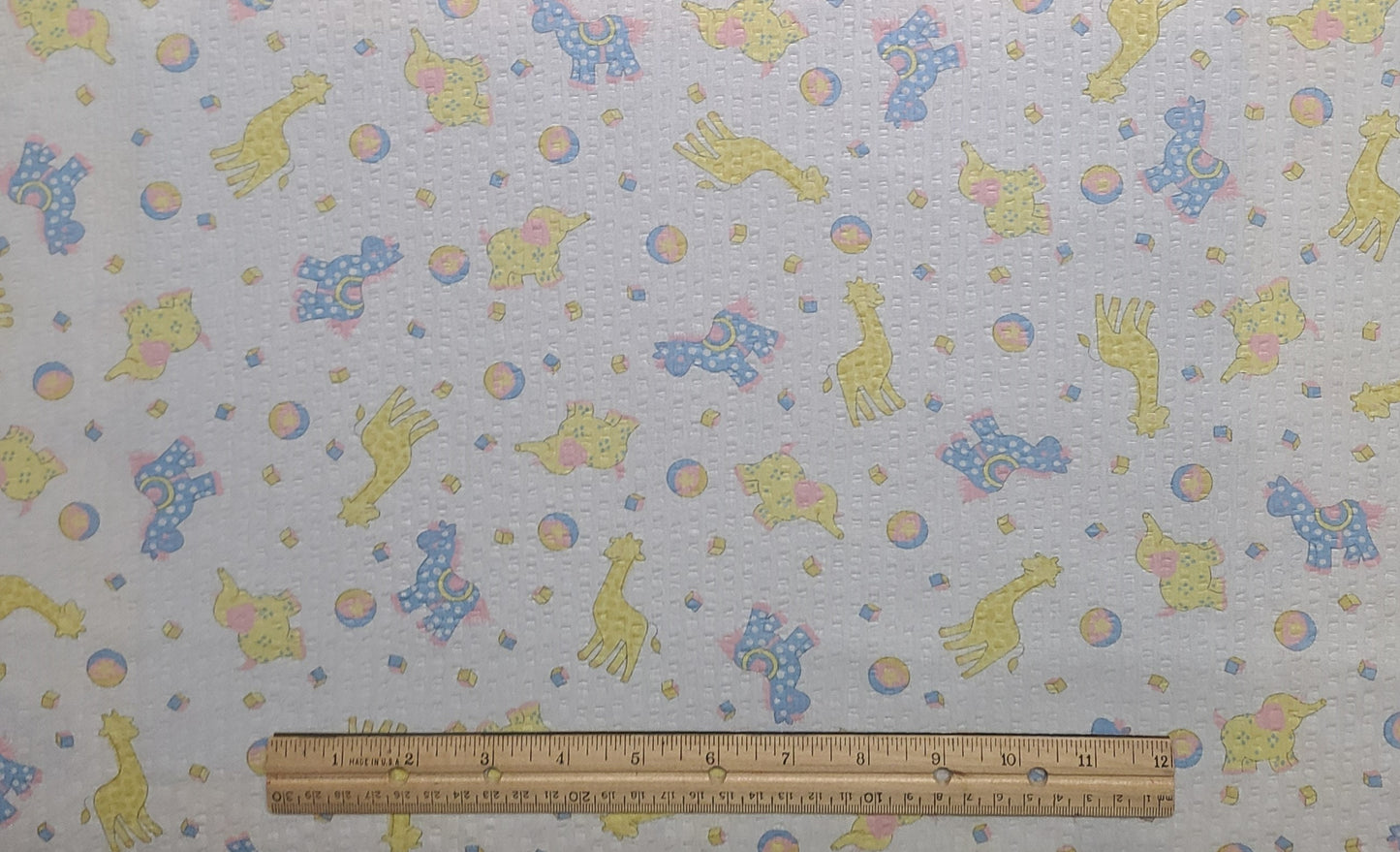 Springs Industries, Inc. - Vintage White Bubble Cotton Fabric / Pastel Yellow, Blue and Pink Nursery Animal Print