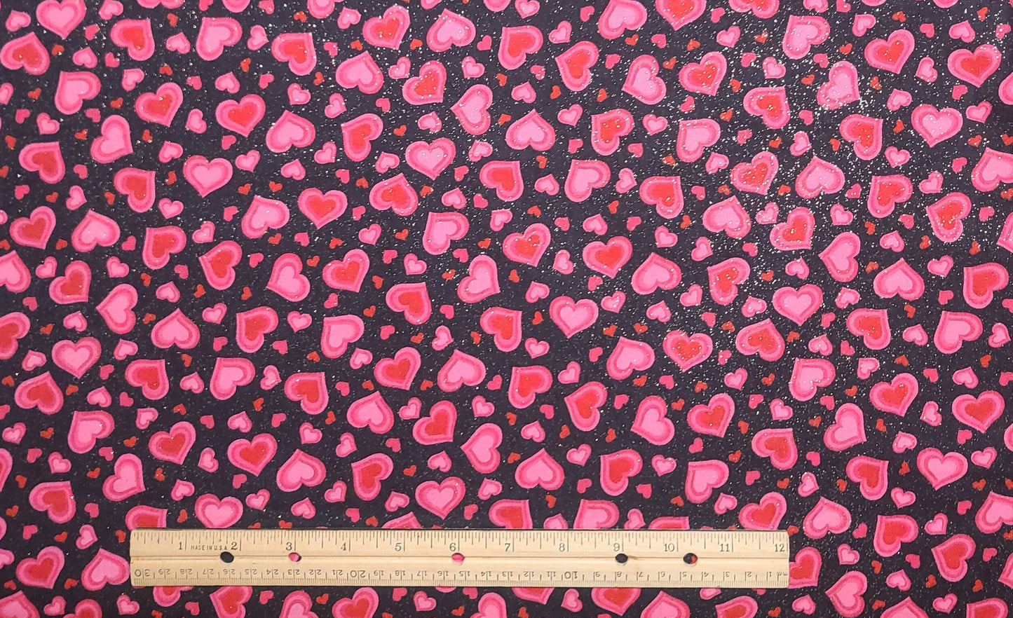 Fabric Traditions 2008 - Black Fabric / Pink and Red Multi-Sized Heart Print / Allover Gold Glitter