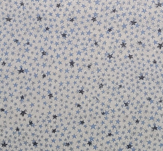 2000 Blank Textiles, Inc. - White Fabric / Light and Dark Blue Scattered Star Print / Allover Silver Glitter