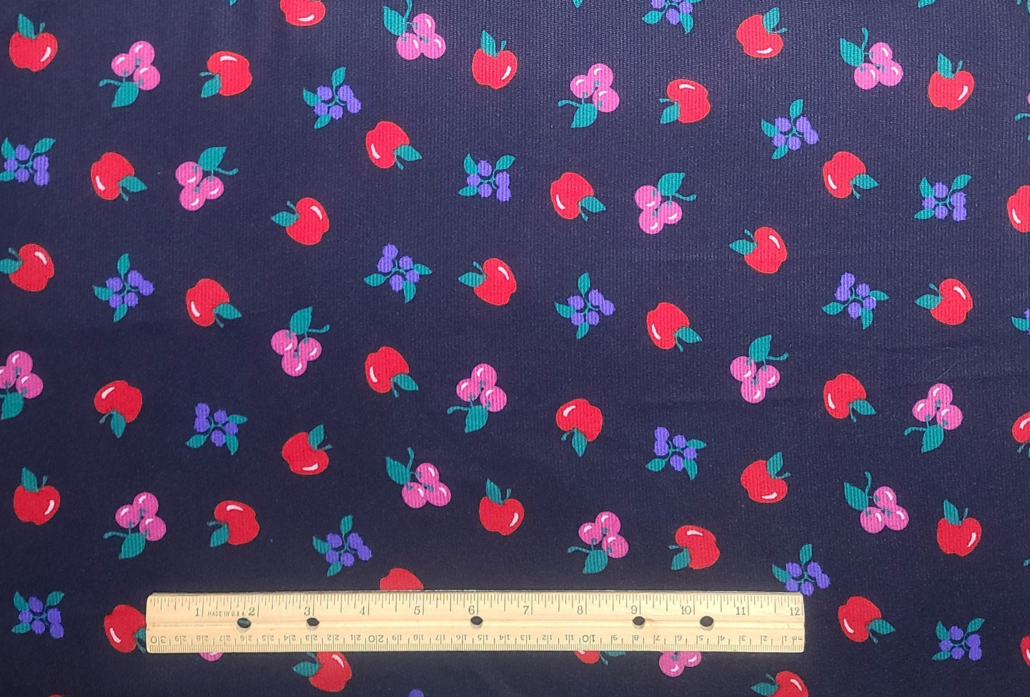 Cranston Print Works Co - Millworth Fabrics - 58" WIDE CORDUROY - Dark Blue Fabric / Scattered Apple, Grape and Cherry Print