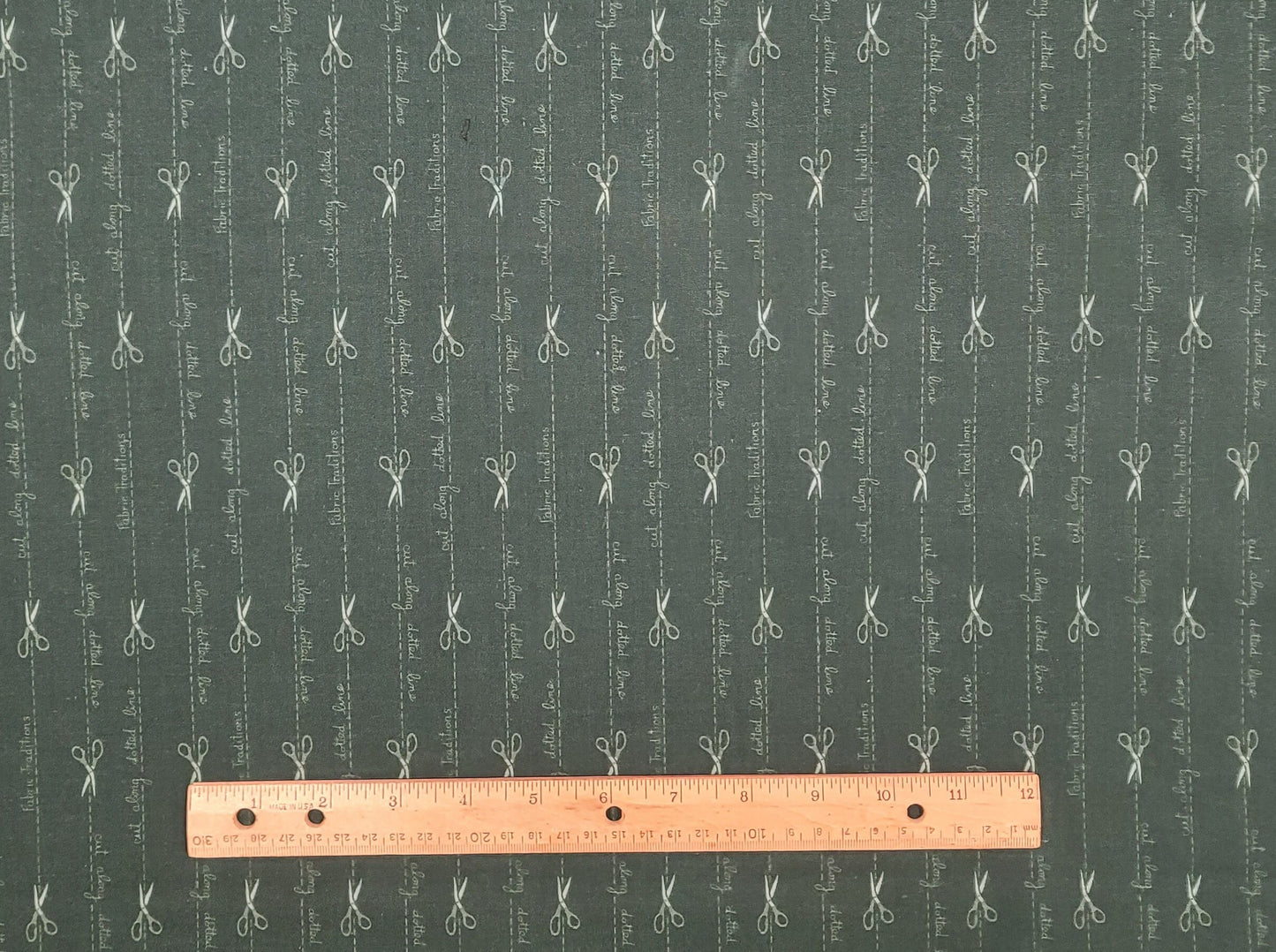 Fabric Traditions 1993 - Dark Green Fabric / Vertical (Parallel with Selvage) Dotted Line and Scissor Print / "Cut Along Dotted Line"