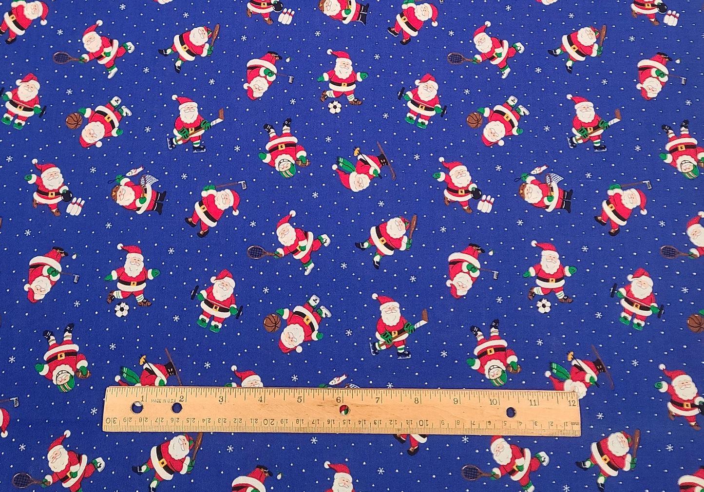 VIP Cranston Print Works - Royal Blue Fabric with White Dot and Snowflake Background / Santa Playing Sports