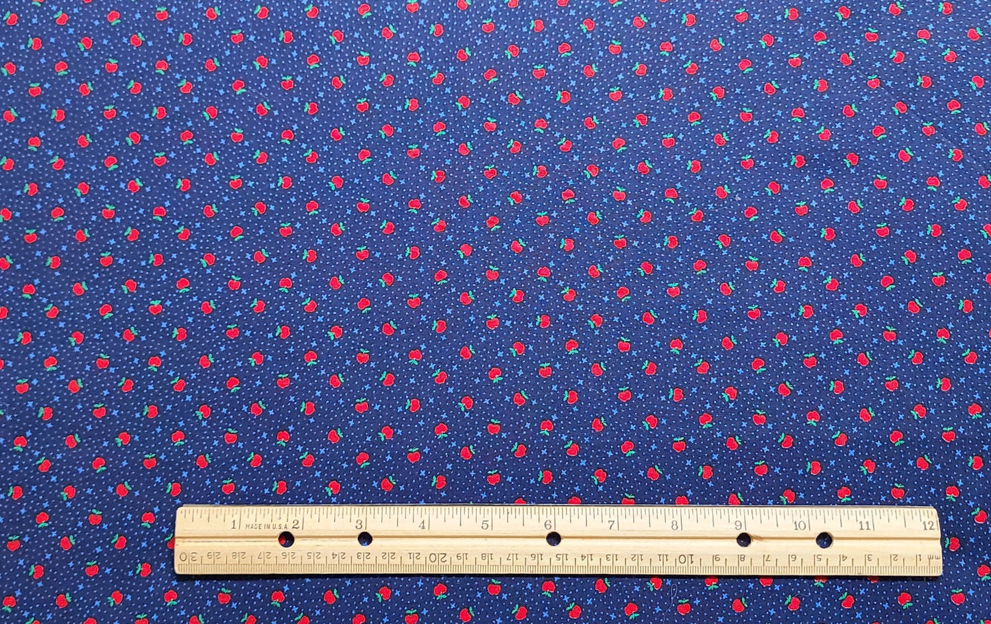 A VIP Cranston Print Works - Dark Blue Fabric / Light Blue Star and Dot Pattern with Scattered Print of Small Red Apples