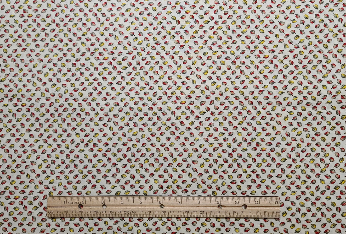 JoAnn Fabric - Soft White Fabric / Red, Green, Yellow Tossed Leaf Print