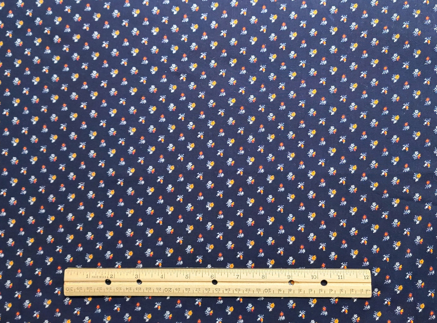 Peter Pan Fabrics Inc - Dark Blue Fabric / Red, Yellow and White Flower Print