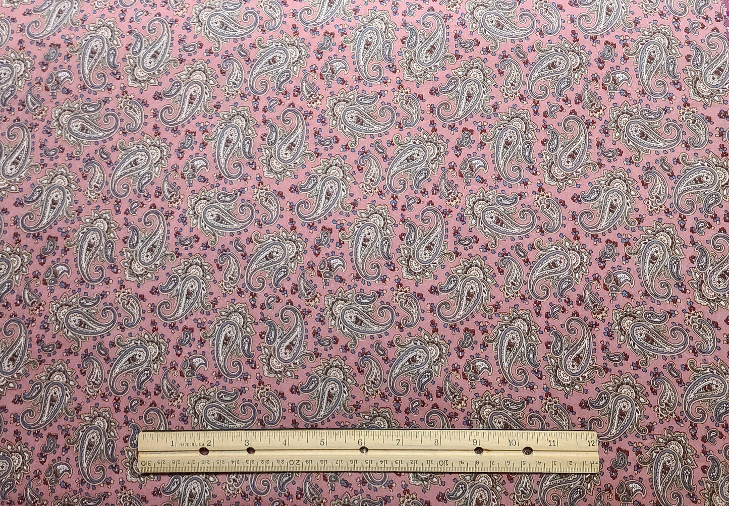 Marcus Bros Textiles Inc - Dusty Rose Fabric / White, Red, Country Blue, Gold Paisley Print