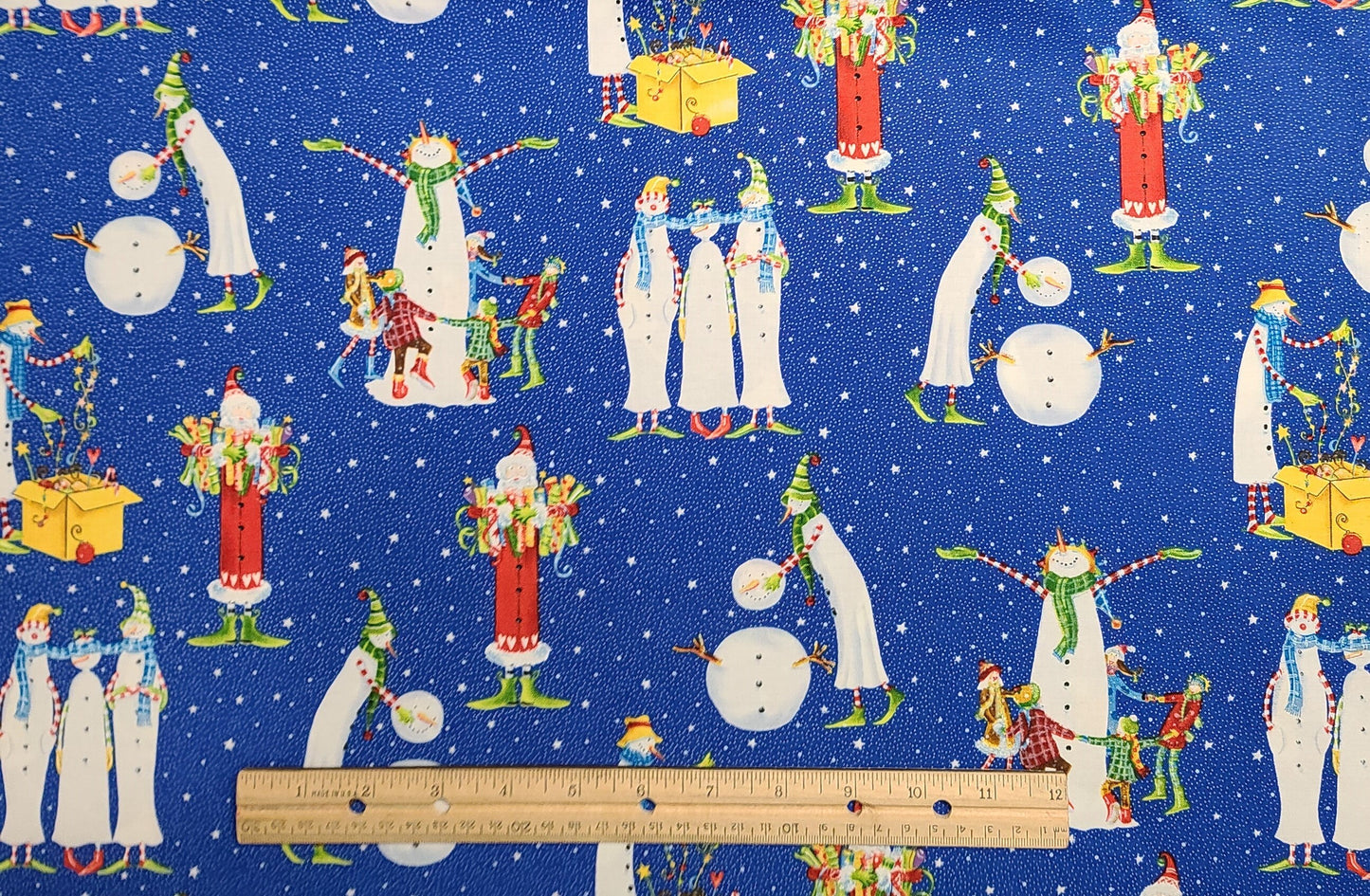 Christmas Magic by Kym Bowles for Marcus Brothers Textiles Inc - Blue Fabric, White Pin Dot, Star Background/Slender Santa and Snowmen Print